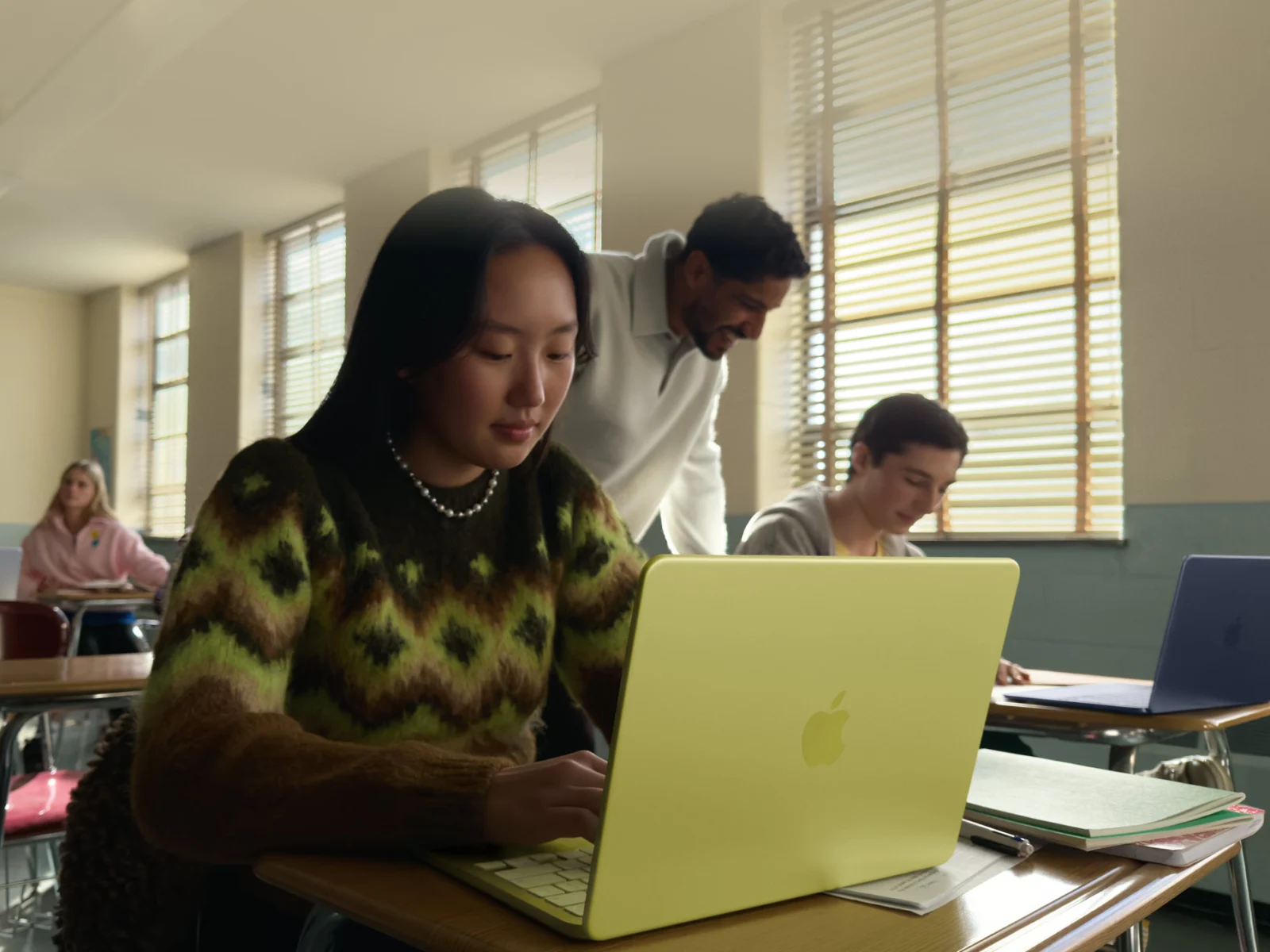 A girl using the MacBook Neo in class