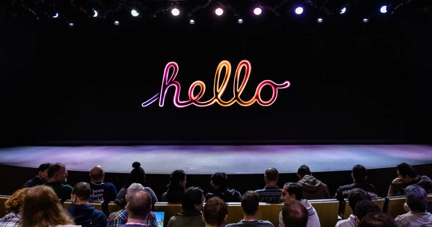 Apple in stage with hello in screen