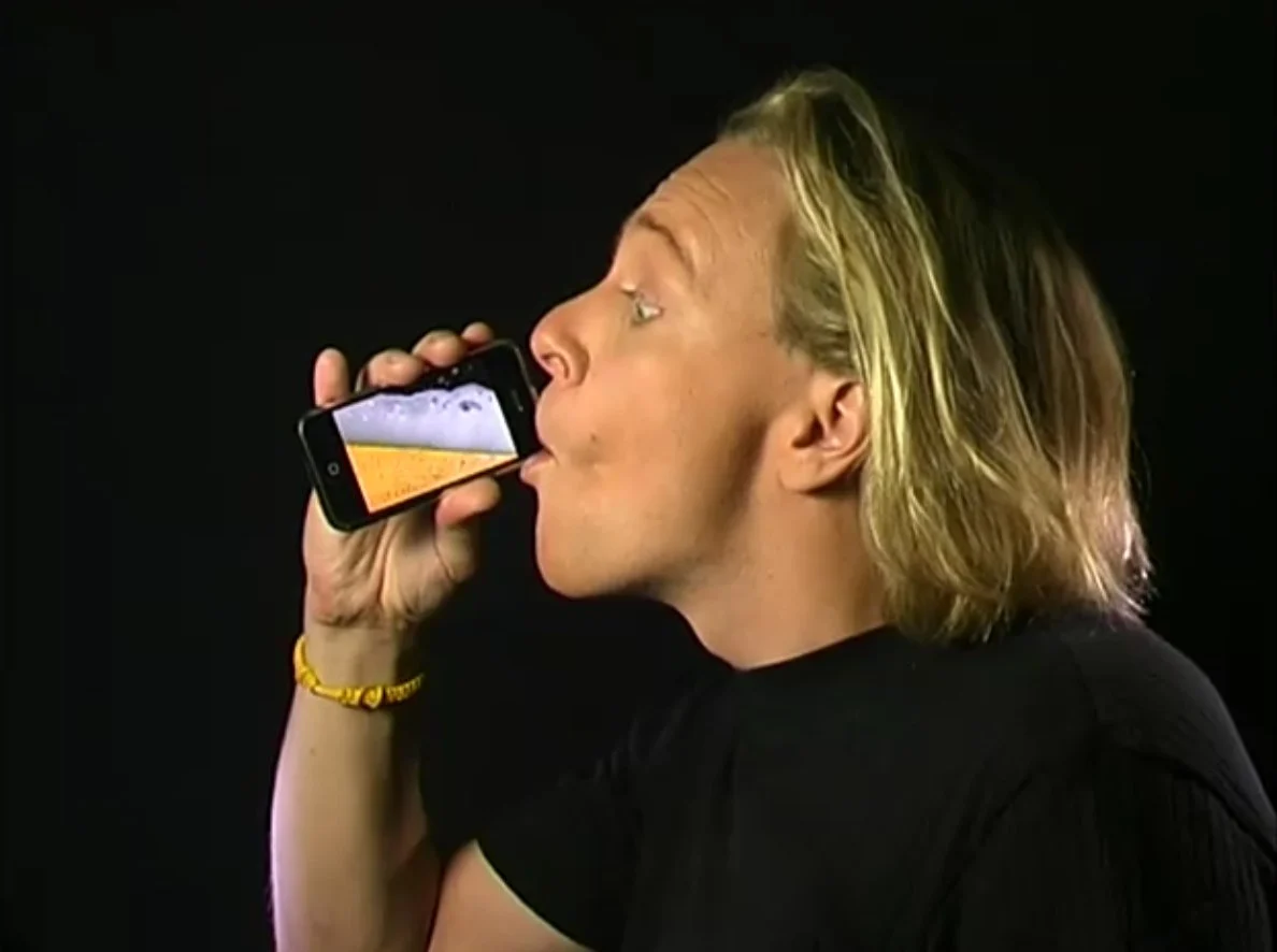 A person drinking virtual beer from his iPhone